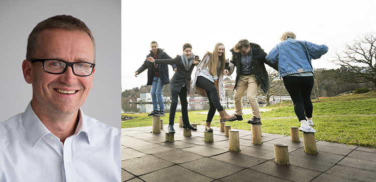 Portrett av Hans Christian Z Thorbjørnsen og fem elever som balanserer på stubber