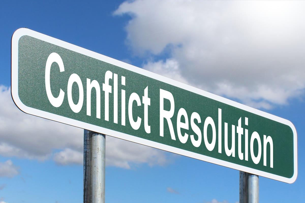Skilt med tekst conflict resolution